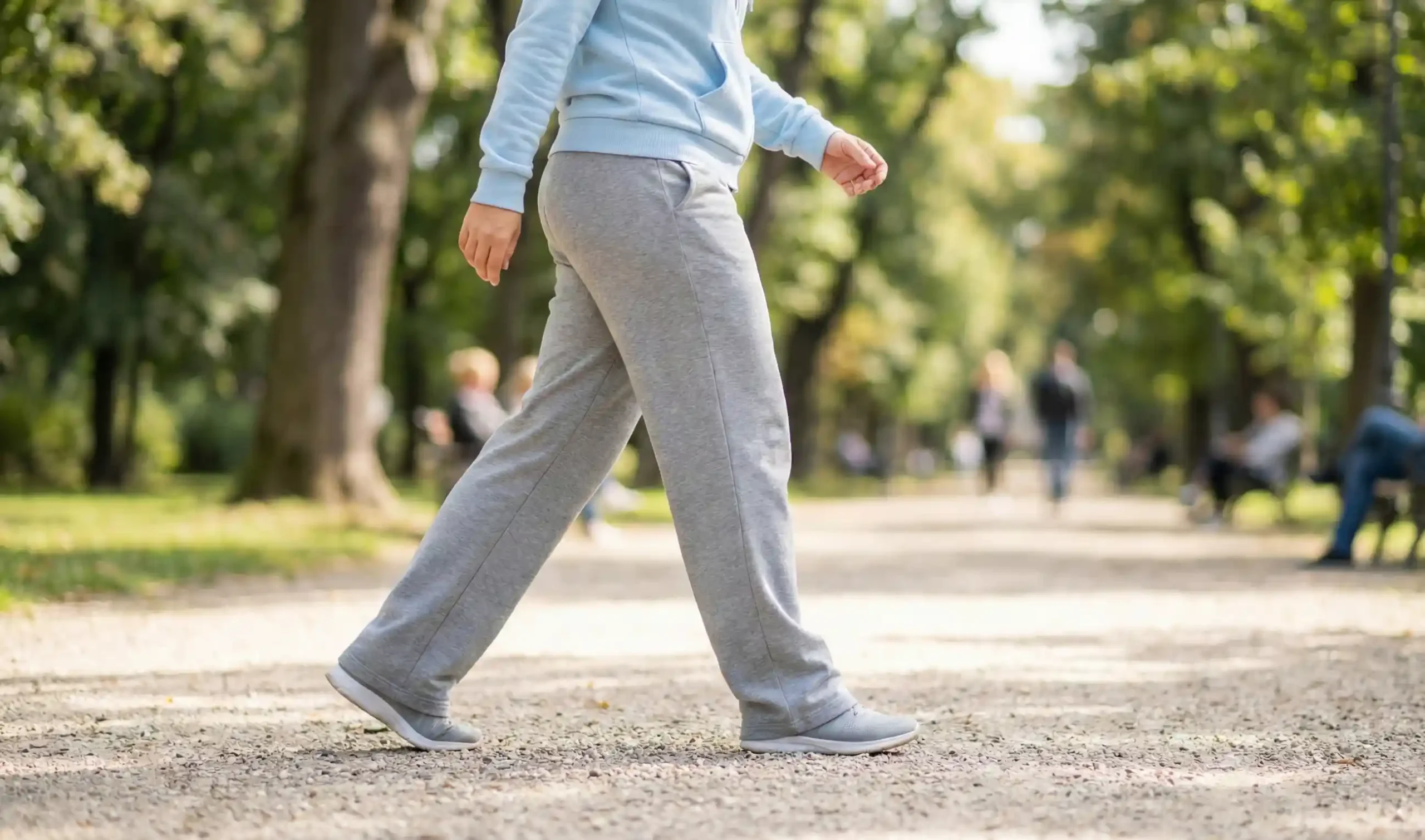 patient walking in park post liposuction recovery