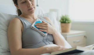 patient applying ice pack post breast surgery