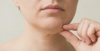 person pinching double chin fat pocket