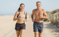 fit man and woman jogging on beach representing active lifestyle at any age