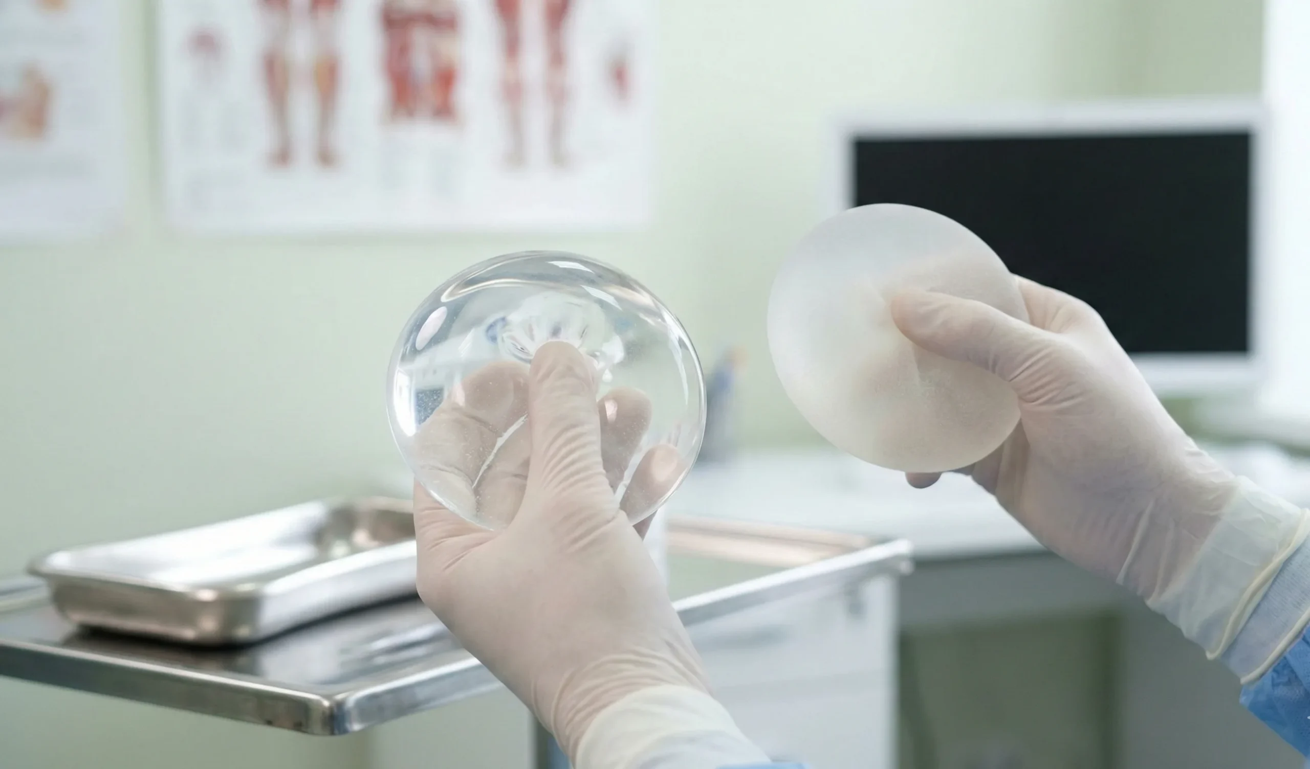 surgeon demonstrating texture difference silicone vs saline implants
