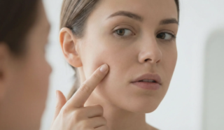 woman pinching cheek fat pocket