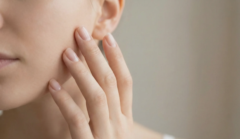 hand touching cheek natural light