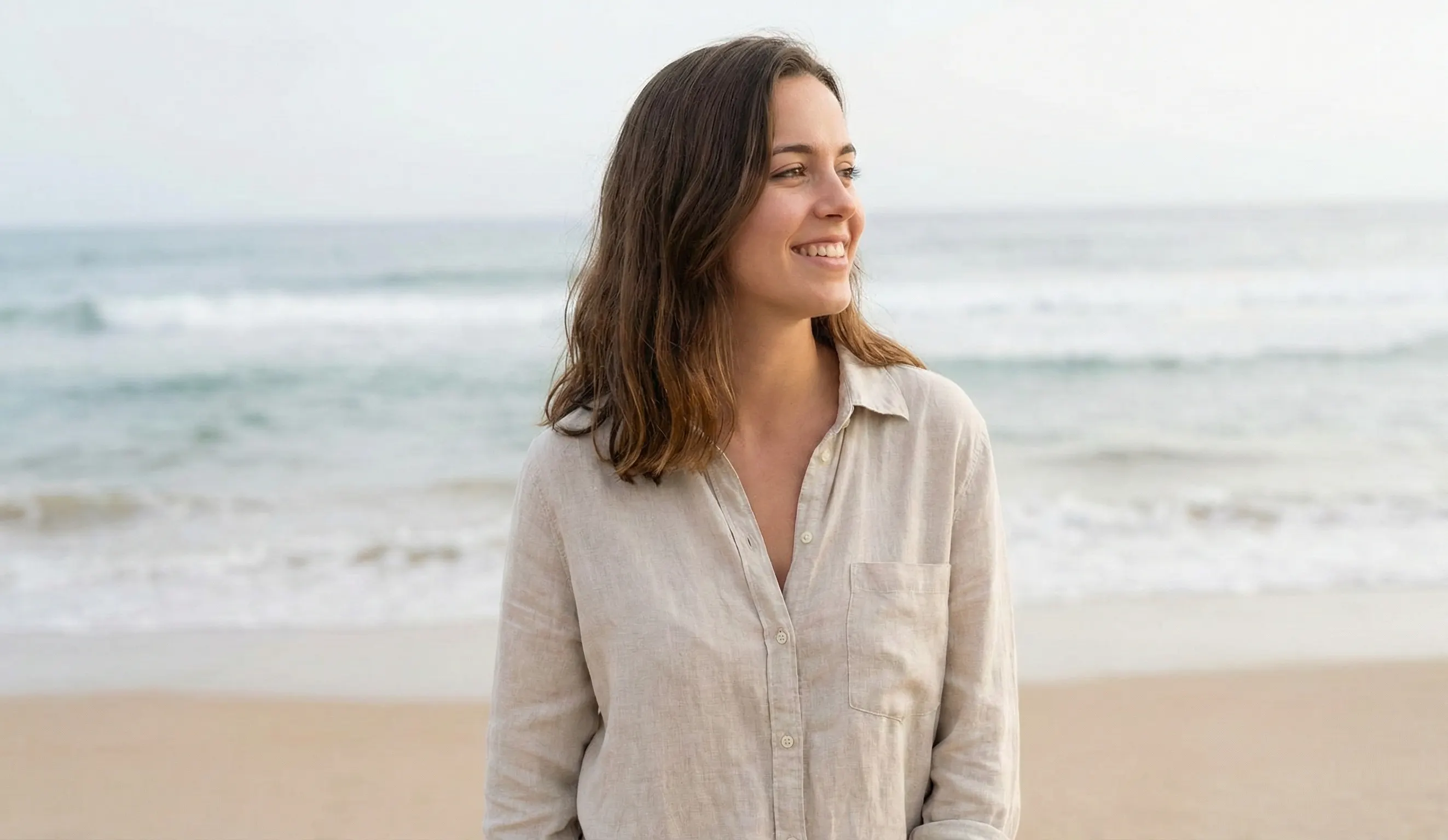 young adult woman smiling beach outdoors