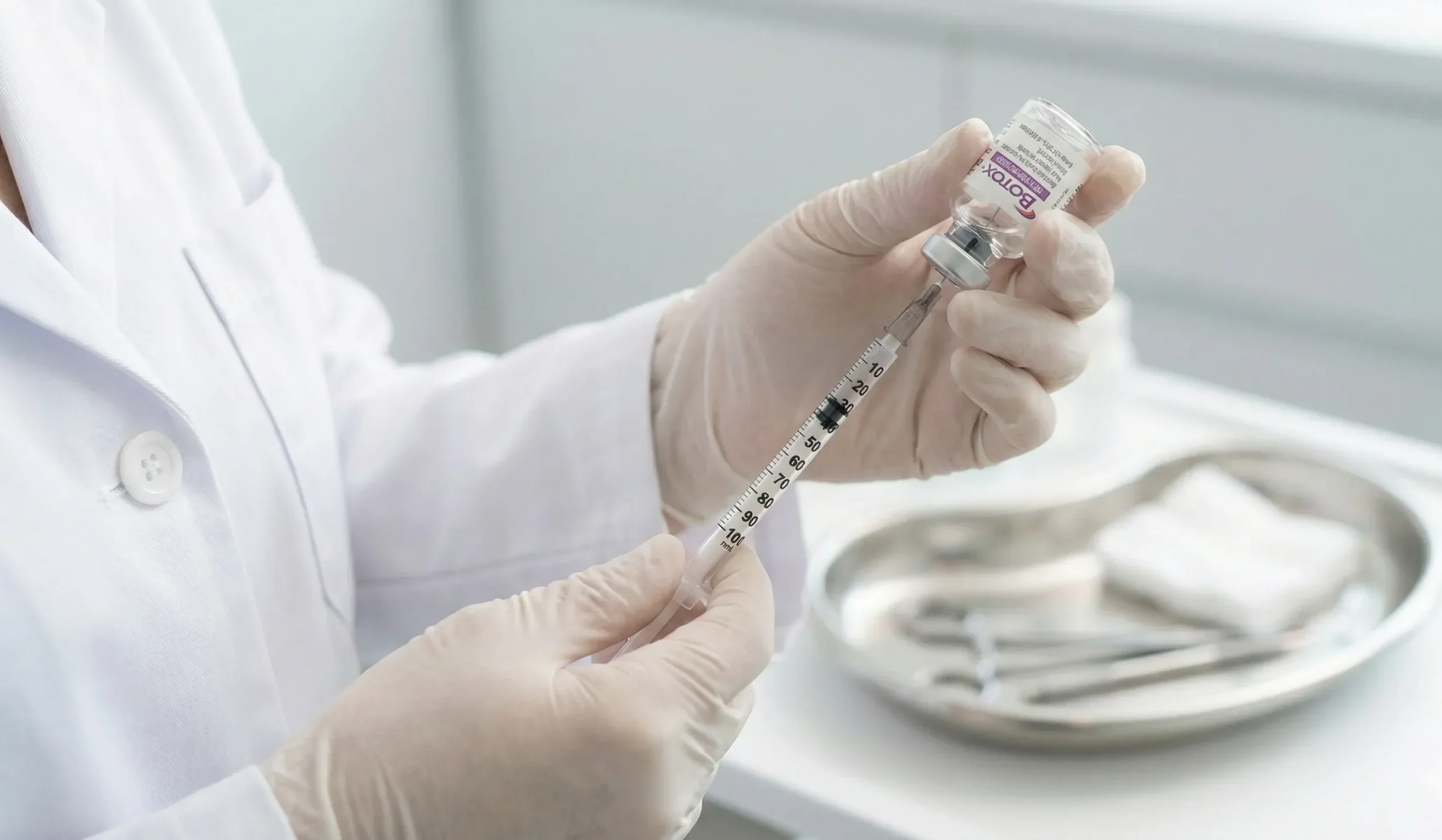 doctor preparing botox syringe closeup