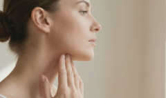 woman touching jawline profile view
